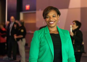Angela Evans Lexington: woman in a green blazer smiling at the camera