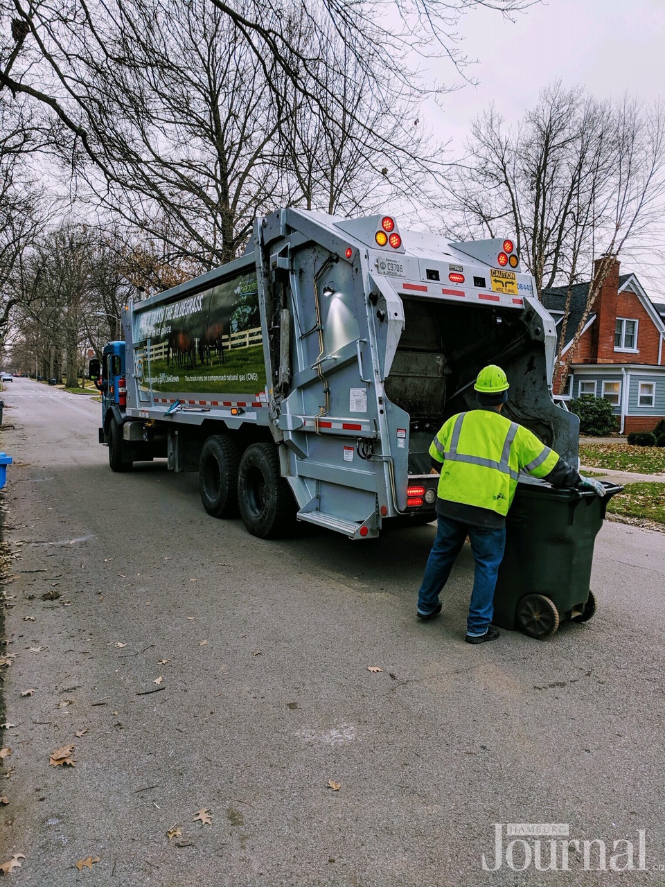 Presidents’ Day: a garbage truck and a trash collector putting a herbie to dump in the truck