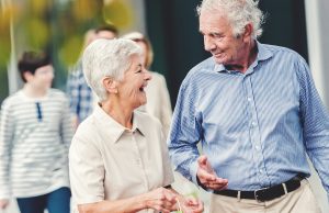 Senior News: an older couple walking and laughing
