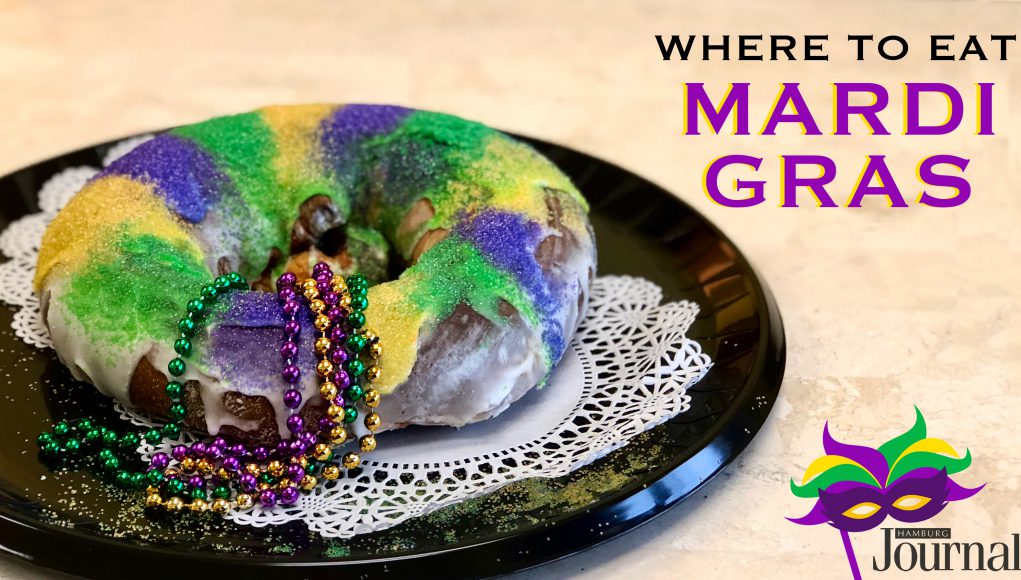 mardi gras: king cake with purple, green, and yellow icing and beads