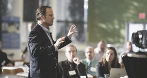 Man giving presentation to group of business people