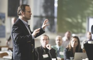 Man giving presentation to group of business people