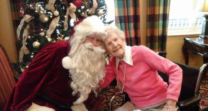santa claus with elderly woman