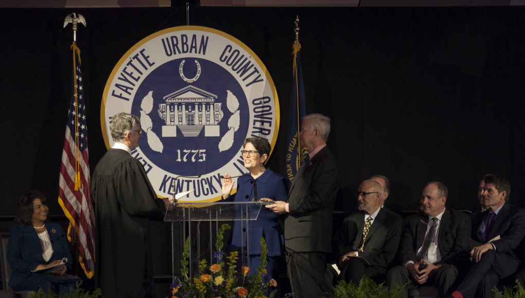 linda gorton and her husban taking her oath of office at the inaugural ceremony