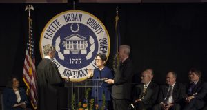 linda gorton and her husban taking her oath of office at the inaugural ceremony