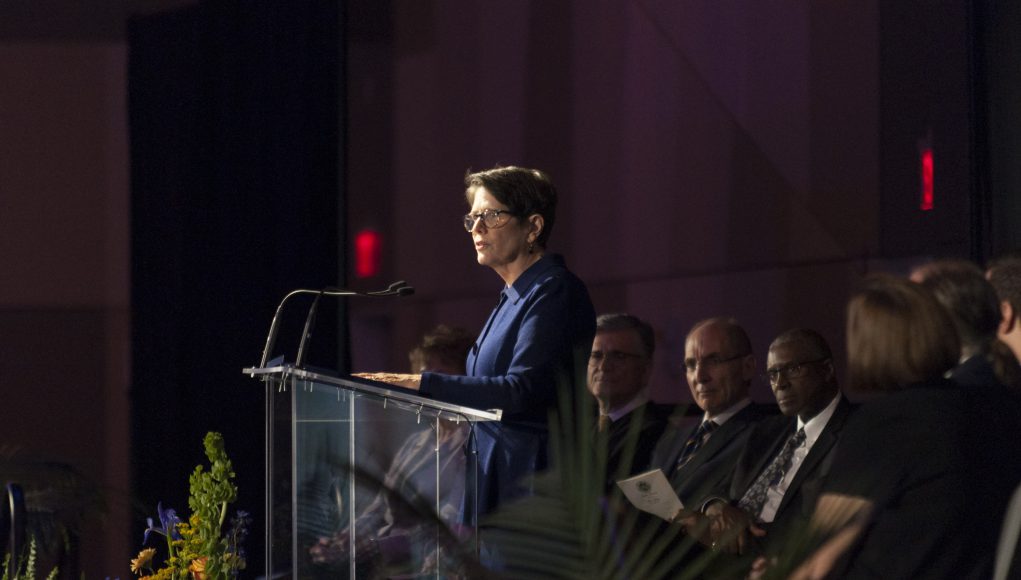 COVID-19 inaugural ceremony: linda gorton at a podium giving a speech