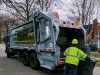 home and garden waste: a garbage truck and a waste collector