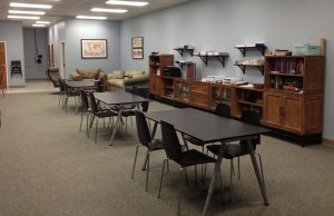 sphinx academy: classroom with tables in the center of the room and counter tops against the wall