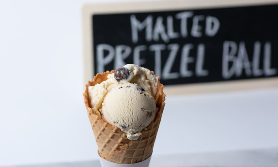 Graeter's Ice Cream: ice cream cone with a chalk board in the back ground