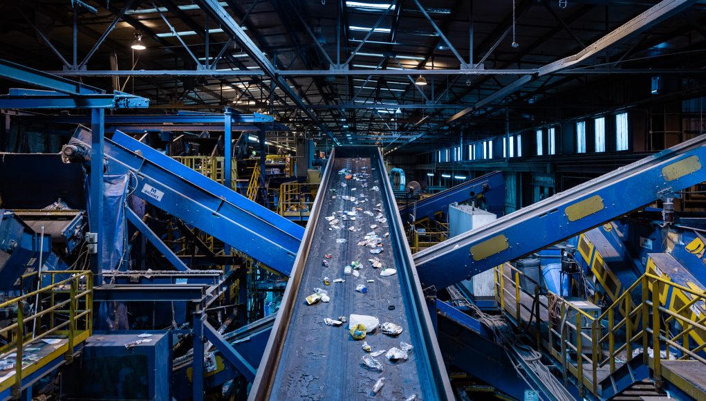 Home and Garden Recycle Center: a conveyor with recyclables