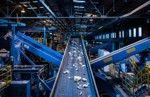 Home and Garden Recycle Center: a conveyor with recyclables