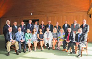 Business Hall of Fame: group of people sitting and standing smiling at the camera