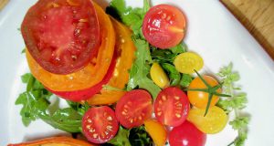 Chef Tom: tomatoes, lettuce, and other foods on a white plate