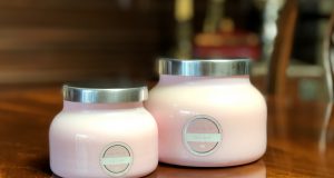 support: pink candles on a wooden table