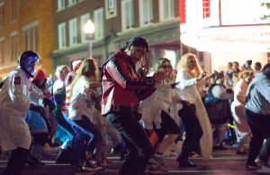 Halloween: a man dressed as michael jackson's thriller dancing in the street