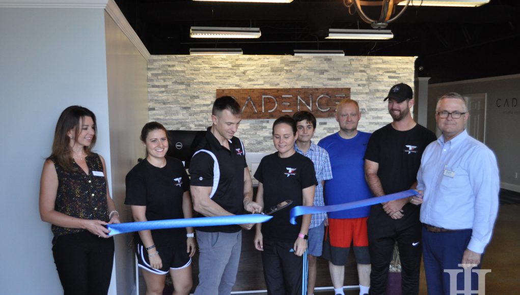Cadence: people participating in a ribbon cutting