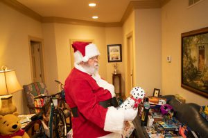 BIA Cares: Santa holding a stuffed toy